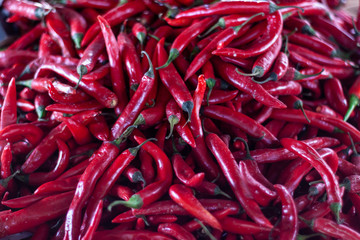 Closeup Pile of fresh red chilli at a market stall. Fruit and vegetable market