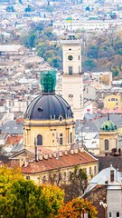 Fototapeta na wymiar Lviv cityscape autumn, ancient buildings. Townhall, Dominican Cathedral, Latin cathedral.