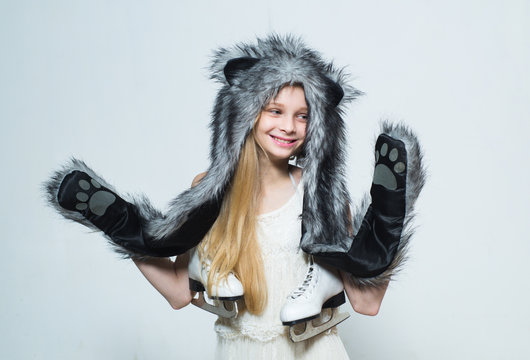 The fun hat design is sure to entertain. Small fashionista. Happy child smile in fashion style. Winter fashion trends for kids. Keeping your little ones happy and warm in winter. Soft furry accessory