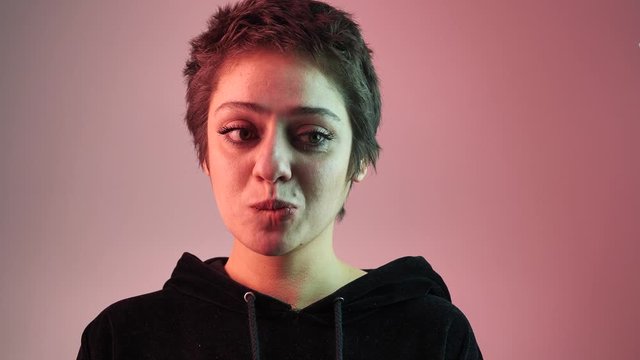 portrait of a girl which is embarrassed and bites her lip 4k
