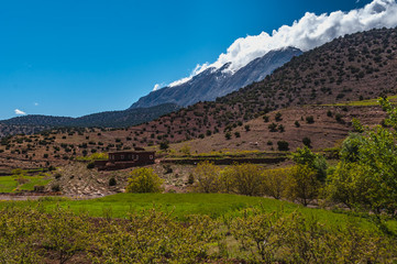 View of adobe houses in the high snow-capped mountains in the Aït Bouguemez valley in Morocco © Nicolas VINCENT