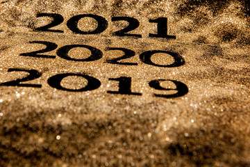 Beautiful sparkling Golden Numbers of 2019 to 2020 on black background for design, happy new year concept