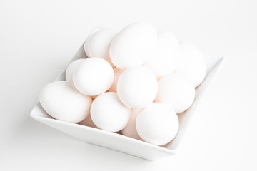 Fresh White Eggs Piled On White Square Bowl