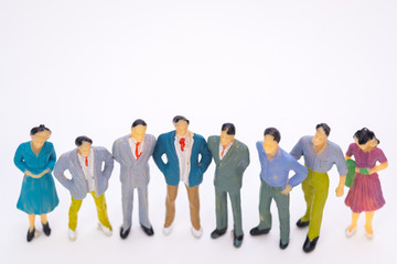 Group of figure miniature businessman or small people investor and office worker secretary on white background for money and financial business teamwork concept.