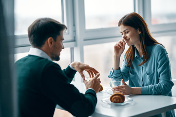 man and woman talking on cell phone