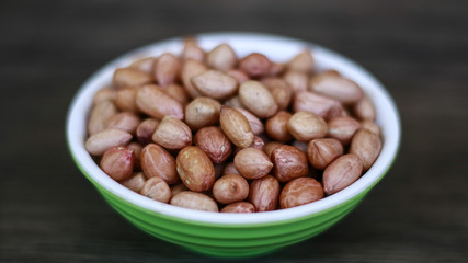 Peanuts or groundnut on wood background.
