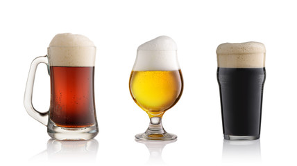red light and dark beer glasses with foam isolated on a white background