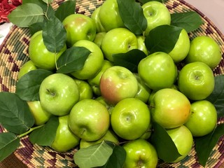 green apples in basket