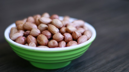 Peanuts or groundnut on wood background.