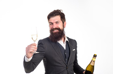 Businessman holds bottle and glass of champagne. Best wishes. Champagne cheers. Man in suit...