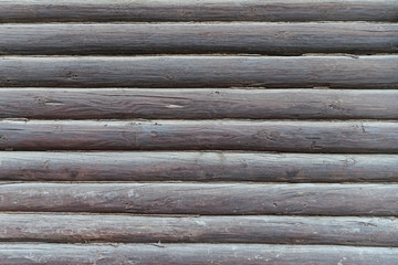 An element of the architecture of an old wooden house made of logs.