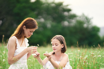 mother and daughter having fun in the park