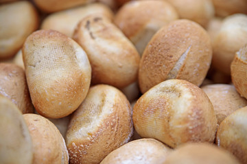 The soft toasted buns are in a box at the grocery store.