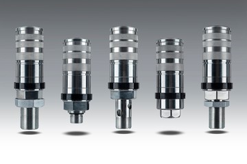 Group of Euro standard Hydraulic quick couplers for quick connect fitting coupling. Made for join hose oil, water and air. Made of stainless steel. Isolated on gray background. 