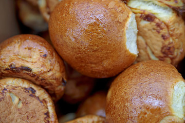 The soft toasted buns are in a box at the grocery store.