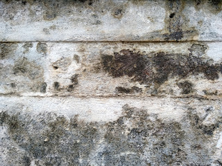 Obraz premium Abstract texture of mossy, porous, cracked and weathered sandstone walls. Wall texture can be used as a wall frame and wall background. Dirty and Old sandstone wall texture background.