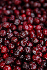Frozen berries in grocery store shot close-up, blurred background.