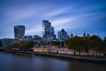 Fototapeta na wymiar The City of London at nightfall with the Tower and Thames in the foreground