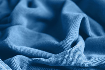 Soft velvet texture classic blue color. Delicate background. The concept of femininity, home comfort, warmth