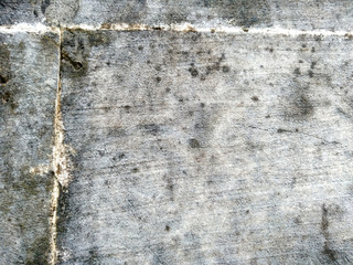Abstract texture of mossy, porous, cracked and weathered sandstone walls. Wall texture can be used as a wall frame and wall background. Dirty and Old sandstone wall texture background.