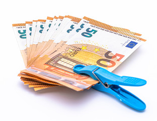 Euro money cash notes held together with a blue clip. Isolated on white background.