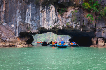 Landscape View of Travelers Enjoy on the Bamboo Boating and Kayaking through Hang Luon Cave, Bo Hon island, Ha Long Bay, Vietnam