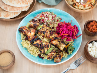 Mediterranean Chicken kabobs. Greek dish made with chicken, rice, onions, and vegetables.