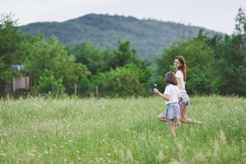 girl in white dress sitting on green grass