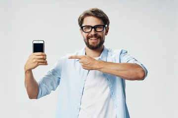 portrait of young man with mobile phone