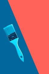 white brush with wooden handle on a blue background