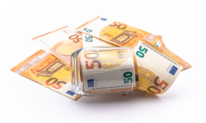 Euro money notes in a glass concept. European currency isolated on white background.
