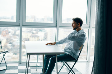 man sitting on chair and looking at camera