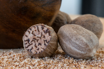 Close Up of Whole Nutmeg and Ground Nutmeg