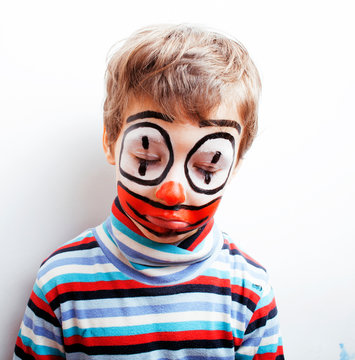 little cute boy with facepaint like clown, pantomimic expressions close up