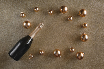 Gold frame from christmas decorations with champagne.