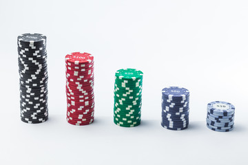 Poker chips on a white background different stacks of isolate