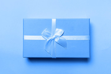 Small gift box colored in trendy color of year 2020 Classic Blue background. Bright Macro color 19-4052. Christmas New Year birthday valentine celebration present romantic concept
