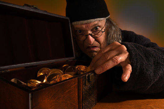 Old Scrooge making sure his gold coins are safe