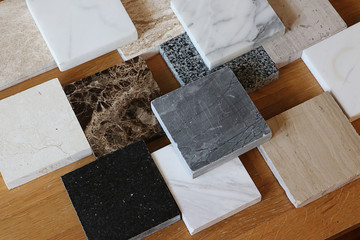 color samples of marble  on oak wood table, stone surface
