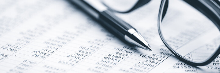  Close-up Of Pen And Reading Glasses On Financial Report - Business Accounting Concept