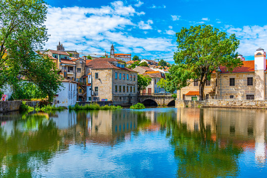 Old buildings in Viseu reflected on a local creek, Portugal