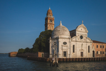 Fototapeta na wymiar Church on island of San Michele with bell tower at sunset, Venice, Italy