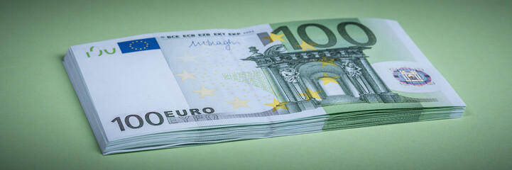 Euro cash on a green background. Euro Money Banknotes. Euro Money. Euro bill. Place for text.