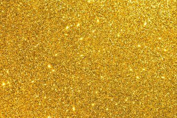 sparkles of golden glitter texture background