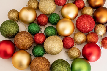 Christmas balls baubles on a light background. Empty space for text input