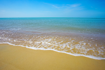 Fototapeta na wymiar Blue ocean with soft wave and blue sky background.
