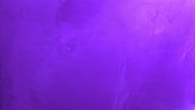 Paint fall into water which is twist. Spin acrylic ink drip into liquid. Visual effect bullet time, frozen moment, flow motion. Cloud fraction of color is spray drop. Slow motion cosmic video magic.