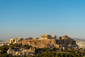 The Acropolis and Parthenon under a blue sky viewed from Phillipappas Hill