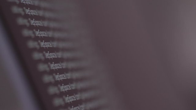 programming code development scrolling on computer screen 4k