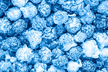 Blue candy popcorn background. Top view.